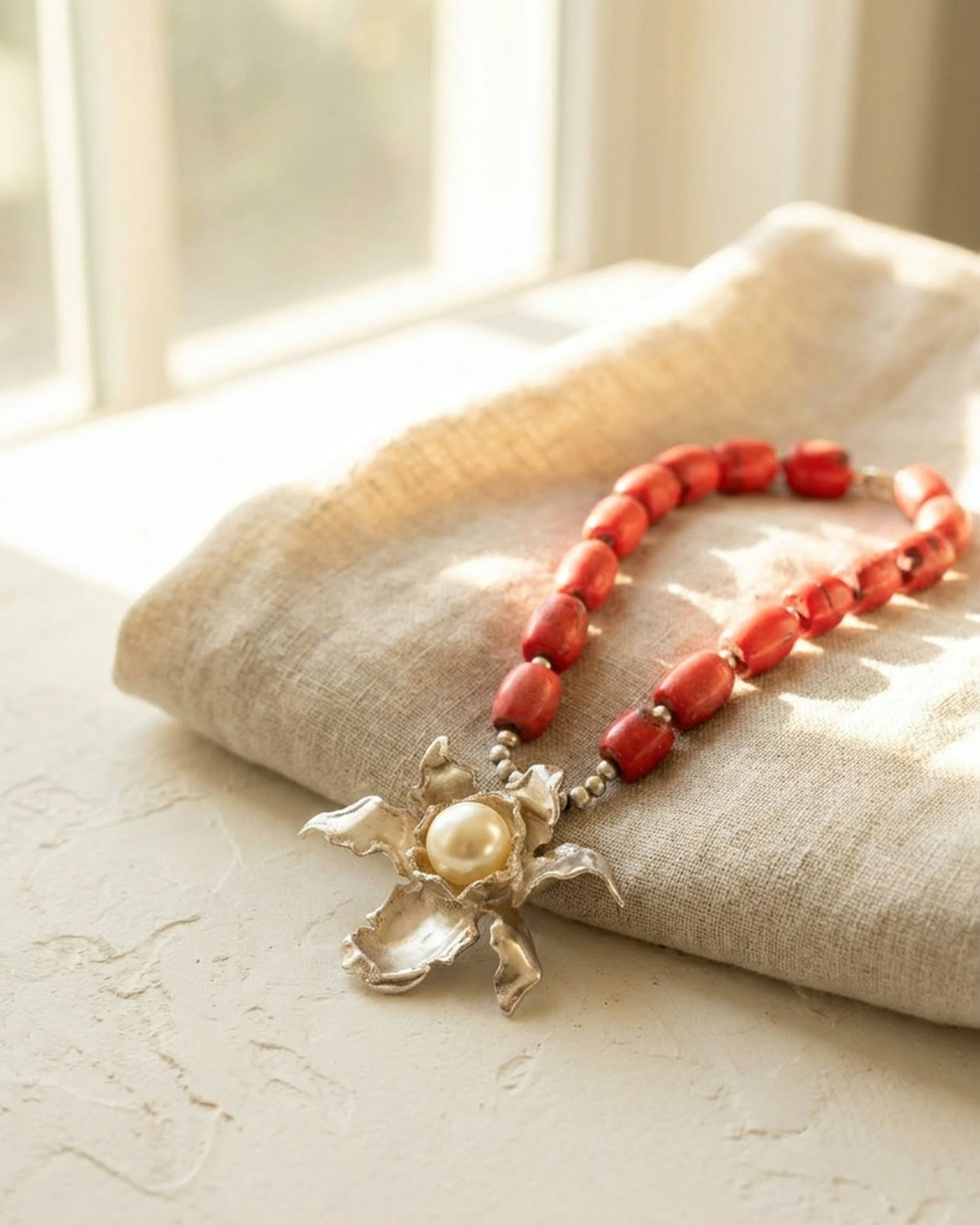Coral bead necklace in cool first light